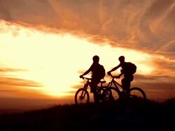 HD Super Slow-Mo: MTB Cyclers Enjoying The View At Sunset Stock Footage