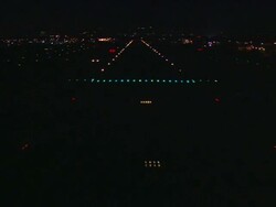 Aerial, night, Van Nuys Airport, airplane POV landing with runway lights / San Fernando Valley, California, United States Stock Footage