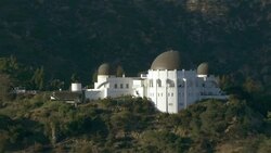 Aerial view of the Griffith Observatory nestled in the Santa Monica Mountains in Los Angeles, California. Stock Footage