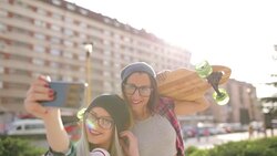Hipster skate girls making selfie Stock Footage