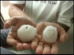 CU Hands holding 2 large hail stones to camera, USA Stock Footage