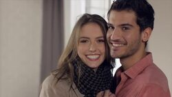 Couple posing with key in new apartment Stock Footage