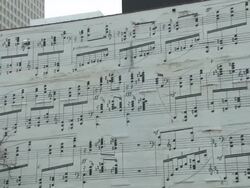 A building on Marquette Ave in Minneapolis painted with musical notes on it Stock Footage