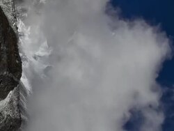 Vertical shot of Time-lapse of clouds passing in front of a Himalayan peak. Stock Footage
