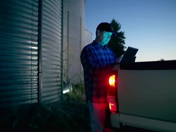 Farmer uses a digital tablet to access the internet Stock Footage