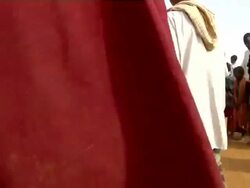 People following UN officer with loudspeaker Stock Footage