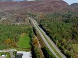MS AERIAL ZO View of town with autumn color trees / Vermont, United States Stock Footage