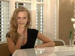 Beautiful Blonde Drinking and Flirting Stock Footage