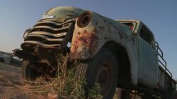 An abandoned truck rusts in the Namib Desert. Stock Footage