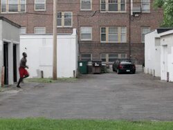 WS Young man running  from out of  garage / Minneapolis, Minnesota, United States Stock Footage