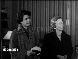 1951: HARVARD UNIVERSITY: DRAMATIZATION: Two male students at Radcilffe dorm, females signing out for date. BOSTON: NIGHT: WS Massachusetts State House & traffic, WS Street scene w/ neon sign 'RKO Keith's', DATING: Student couples walking in building Instructional Video