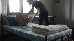 Young man traveler in the hostel Stock Footage