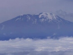 Peak of Mt Kilimanjaro from airplane, Tanzania Stock Footage