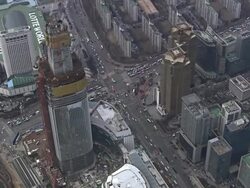 WS AERIAL ZI View of second lotteworld(Big Theme Park that will be built in 2015)under construction and Traffic in Jamsil / Seoul, South Korea Stock Footage