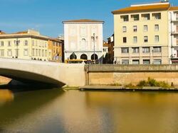 People walking over a bridge across Arno river Stock Footage