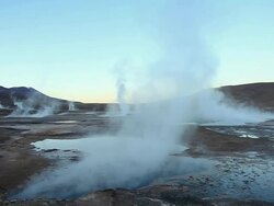WS Geyser pools with steam coming out in early morning light / Geiser del Tatio, Atacama desert, Chile Stock Footage