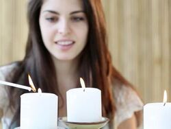 MS R/F Woman lighting candles  / Jersey City, New Jersey, United States Stock Footage