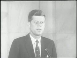 U.S. Senator John F. Kennedy announces his bid for president as his wife, Jacqueline Kennedy, looks on. News Clip