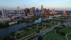 Over Austin at Sunset with all the colors of the Rainbow Displayed Along the Capital City Stock Footage