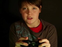 BOY AGED 12 PLAYING COMPUTER GAME Stock Footage