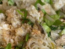 Mixing Bibimbap (Famous Korean dish_Bibimbap is served as a bowl of warm white rice topped with vegetables and fried egg with Gochujang red pepper sauce) Stock Footage