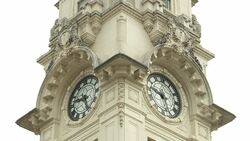 Sculptures decorate an ornate clock tower. Stock Footage