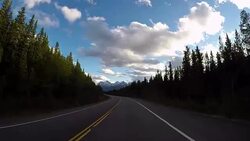 Car driving on Icefields parkway scenic road Stock Footage