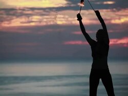 MS Woman poi dancer performing at sunrise / Montezuma, Costa Rica Stock Footage