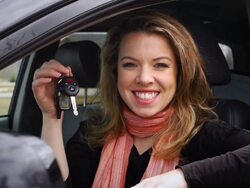 Young smiling woman with key Stock Footage