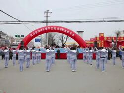 MS Kindergarten teacher dancing in traditional festive folk celebration or carnival during chinese spring festival  AUDIO  / xi'an, shaanxi, china Stock Footage