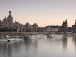 WS View of Dresden skyline and river boats on Elbe river at sunset / Dresden, Saxony, Germany Stock Footage