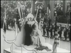 Crowds of people march in the National Recovery Administration parade. News Clip