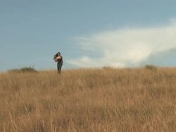 MS ZI American Indian young woman walking on great plains in grass / Pine Ridge, South Dakota, United States    Stock Footage