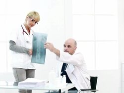 Doctor looking at x ray Stock Footage