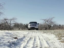 MS Two young man driving truck on snowy and rural road during day / Stillwater, Minnesota, United States Stock Footage