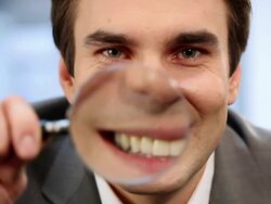 Man with magnifying glass Stock Footage