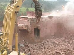 MS Demolition of crushing machine at quarry by bulldozer / Taben-Rodt, Rhineland-Palatinate, Germany Stock Footage