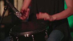 close up of human hand playing drum at party night club Stock Footage