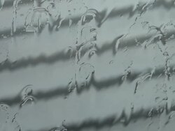 Bad weather: rain drops sliding on glass window Stock Footage