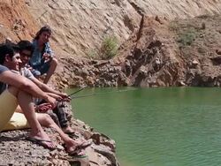Friends fishing at riverbank, Haryana, India Stock Footage
