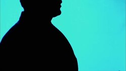 A man in silhouette gestures with his hands as he speaks. Stock Footage