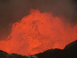 Lava surges in crater at dusk, Marum Volcano, Ambrym Island, Vanuatu Stock Footage