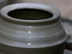 Potter Making a Pot on Spinning Wheel Stock Footage