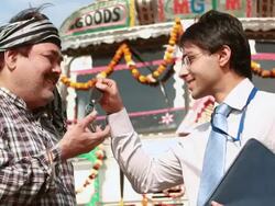 Salesman giving keys to a truck driver, Ballabgarh, Haryana, India Stock Footage