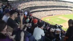 A mother and daughter watch the San Francisco Giants play the Arizona Diamondbacks in the right field bleachers at AT andT Park in San Fransisco. Stock Footage