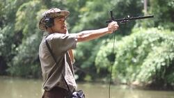 An ornithologist using radio telemetry,tracking to find an wildlife in tropical rainforest Stock Footage