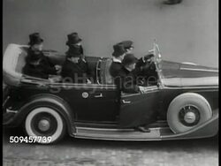 1933: FRANKLIN ROOSEVELT INAUGURATION: (March 4) MS President Herbert Hoover & Franklin D. Roosevelt in convertible car (frame skip), Secret Service. HA WS Car driving off. LA MS FDR taking oath (no SOT). HA XWS U.S. Capitol, crowds, Washington D.C. Instructional Video