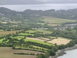 WS AERIAL View of Coast East of Brest with river inlets and farm fields / Brittany, France Stock Footage