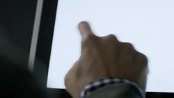 Customer writes signature with index finger on tablet touchscreen at checkout counter in local shop Stock Footage