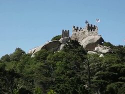 Sintra, Castle of the Moors (Castelo dos Mouros), view of the Royal tower and the Pena Palaca in the background, Sintra  Stock Footage